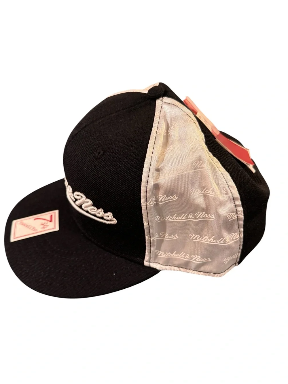 7 3/4 Mitchell & Ness Black and White with Satin sides.